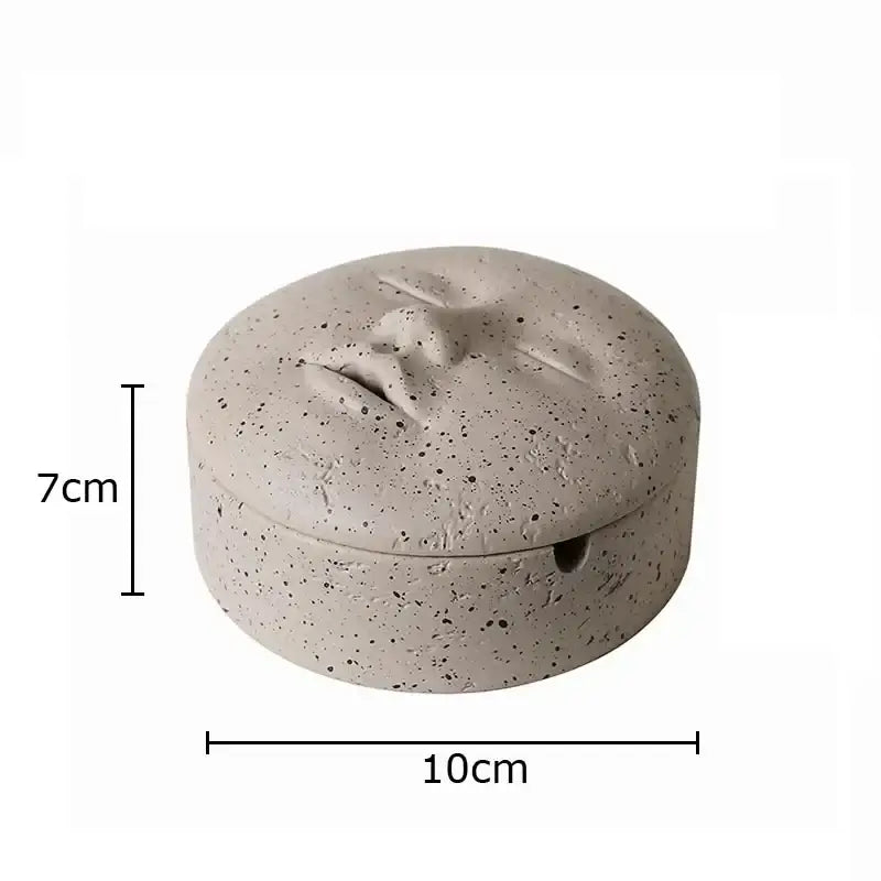 Beige ceramic human face character ashtray with lid featuring gray speckled textured decorbites human face design