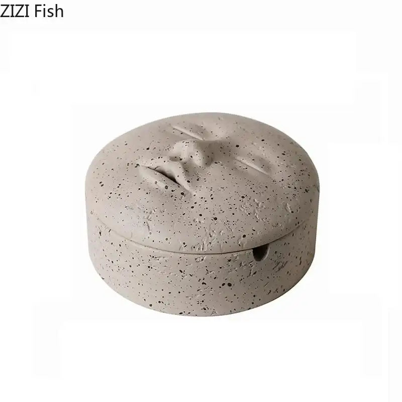 Beige ceramic human face character ashtray with lid featuring gray speckled sculpted face design decorbites human face
