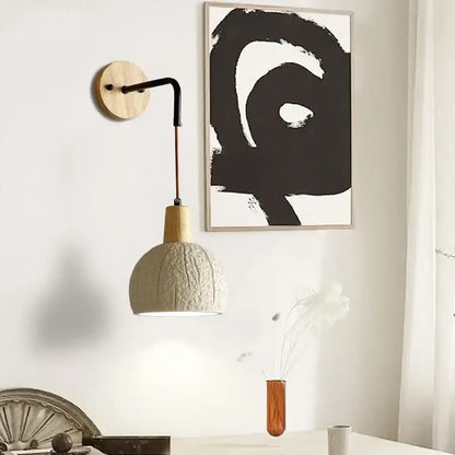 Beige ceramic wall sconce with textured off-white ceramic pendant lamp, wooden neck, and pull chain switch for bedroom