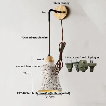 Beige ceramic wall sconce with white cement textured lampshade hanging from wooden canopy with pull chain switch