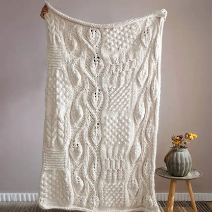 Beige chunky knit tassel blanket with intricate cable-knit patterns and soft cozy decorbites beige chunky texture