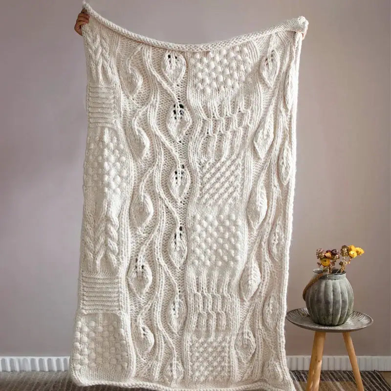 Beige chunky knit tassel blanket with intricate cable-knit patterns and soft cozy decorbites beige chunky texture
