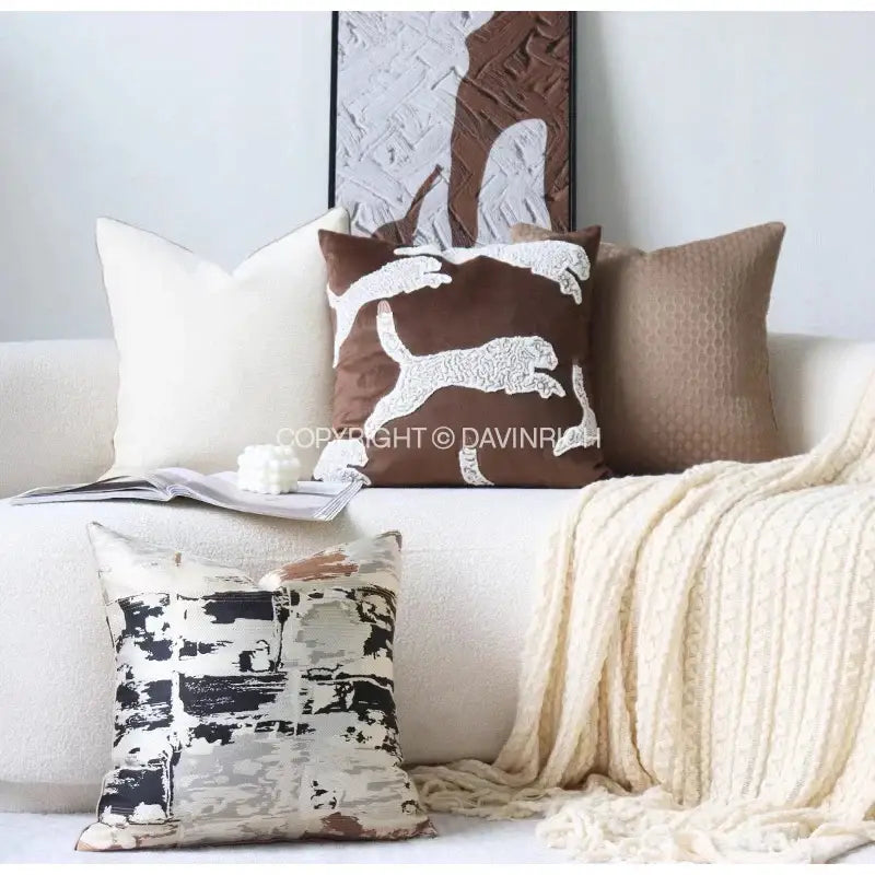 Brown cushion with white embroidered leaping cat design on beige convex rings geometry jacquard living room cover by decorbites