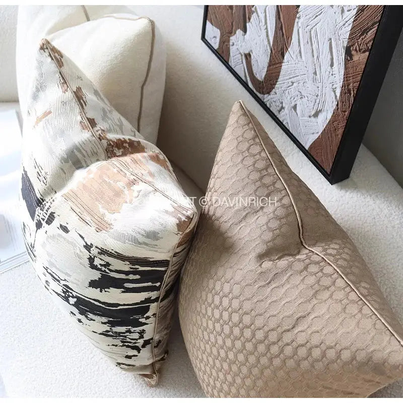 Two decorative throw pillows featuring beige convex rings geometry jacquard and taupe honeycomb texture for living room decor