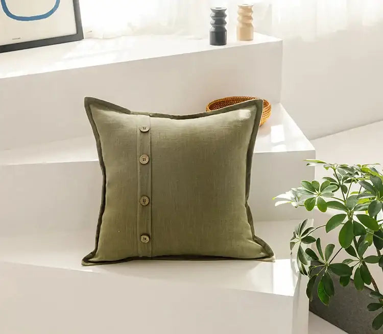 Beige cotton linen cushion cover with olive green linen throw pillow and four vertical wooden buttons for living room decor