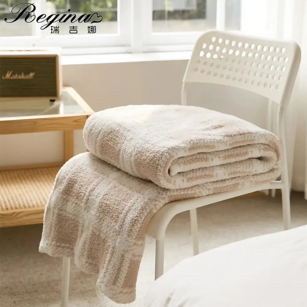 Beige plush terry cloth bath towel with soft textured surface and subtle vertical ribbing for decorbites fluffy stripe plaid blanket