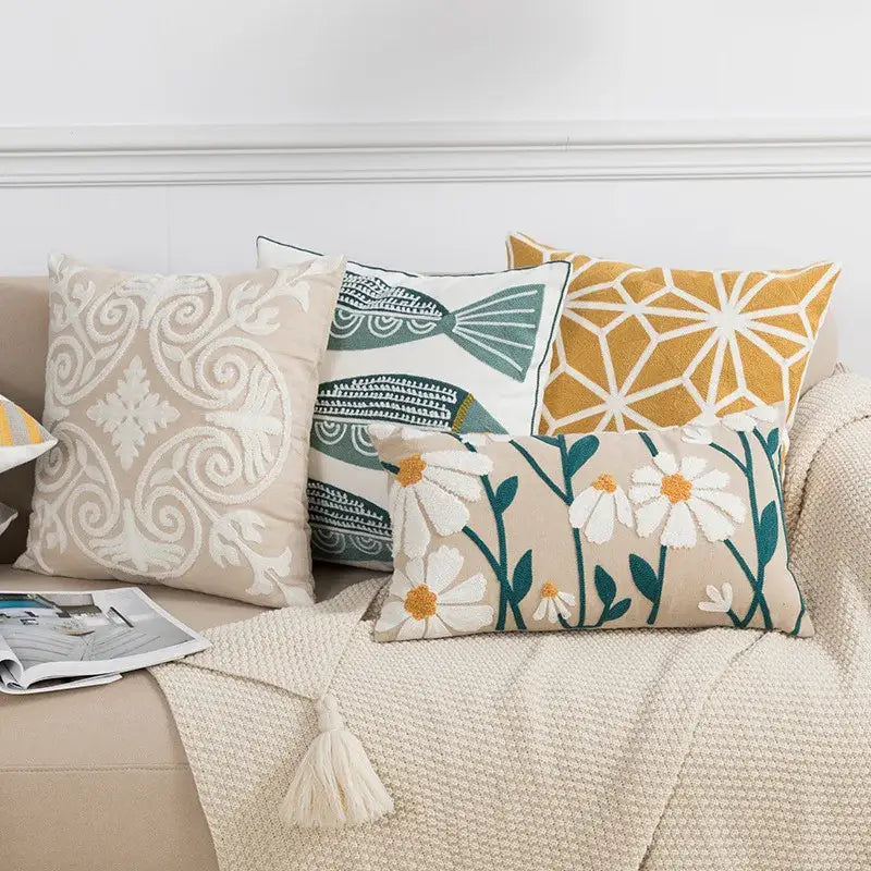 Beige pillow cover with embroidered white daisies and green stems for decorbites daisy floral geometric decor