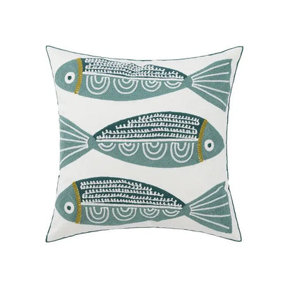 White cushion pillow cover with three embroidered teal fish featuring white and gold detailing for decorbites daisy floral geometric decor
