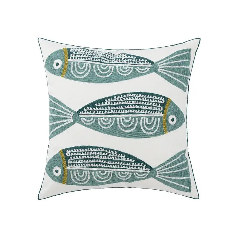 White cushion pillow cover with three embroidered teal fish featuring white and gold detailing for decorbites daisy floral geometric decor