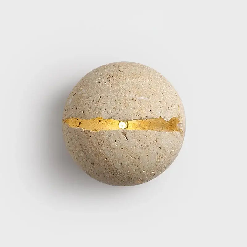 Beige dino egg stone wall lamp with textured concrete surface and gold leaf accent for bedroom decorbites dino egg wall lamp