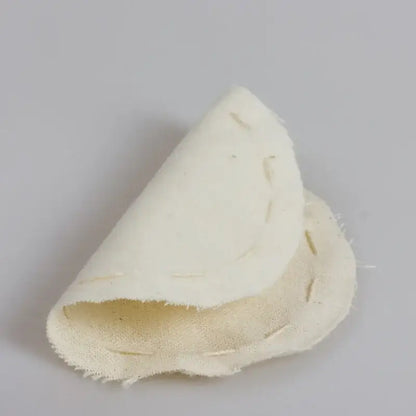 A beige eco-friendly flannel cloth coffee filter pouch with a soft textured surface and visible stitching edges