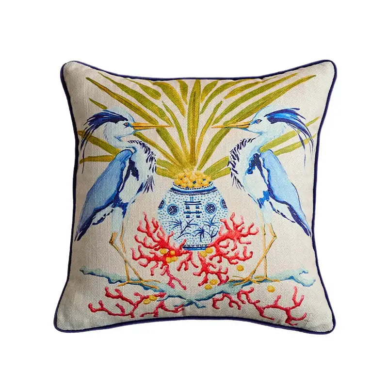Beige pillow case with embroidered blue egret bird pattern for living room sofa featuring blue vase and red coral decor