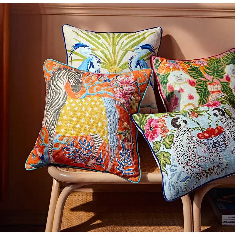 Beige pillow case with vibrant egret bird pattern and colorful patchwork embroidery for living room sofa use