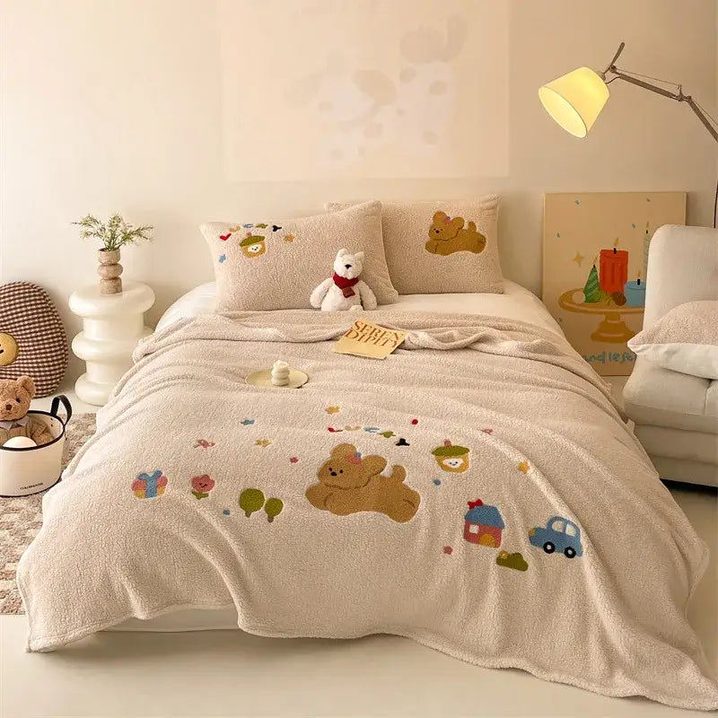 Beige embroidered teddy fleece blanket with cartoon bears houses and cars in soft pastel colors cozy teddy fleece by decorbites