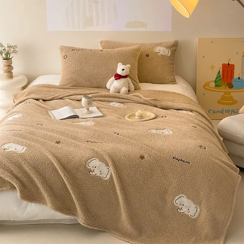 Beige embroidered teddy fleece blanket with white cloud and elephant patterns for decorbites cozy teddy fleece comfort