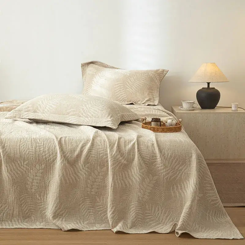 Beige quilted cotton linen bed sheet set with subtle fern leaf pattern for bedroom bedding use