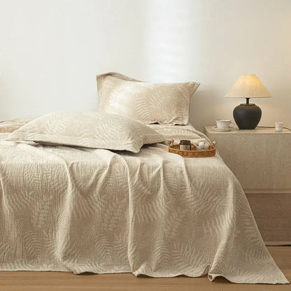 Beige quilted cotton linen bed sheet set with subtle fern leaf pattern for bedroom bedding use