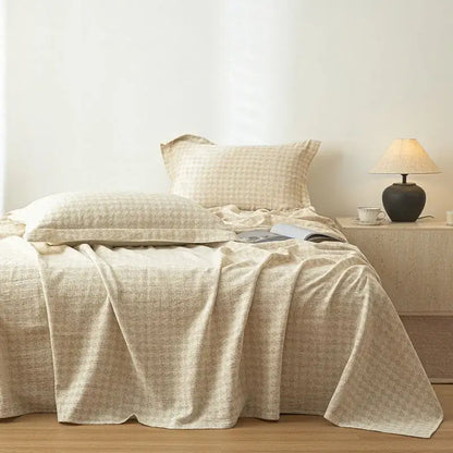 Beige fern leaf cotton linen bed sheet set featuring a textured bedspread with a subtle woven pattern for bedroom use