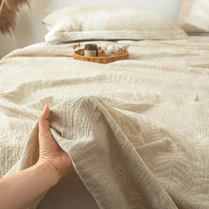 Beige textured cotton linen bed sheet set with subtle fern leaf pattern for bedroom bedding use