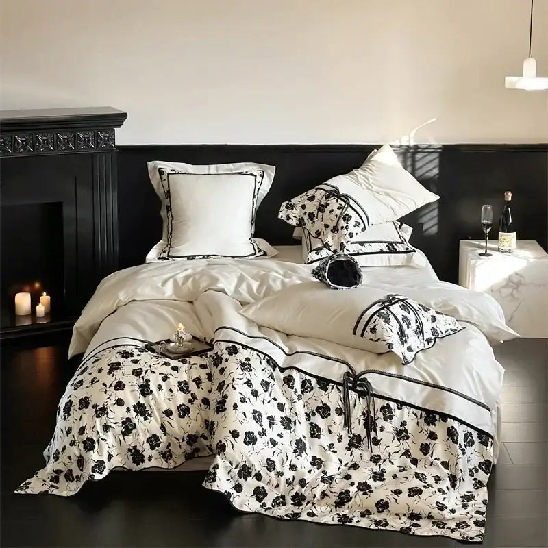 Beige floral satin cotton patchwork bedding set featuring white bedding with black floral patterns and elegant trim