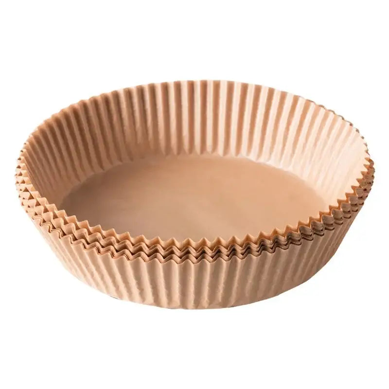 Beige fluted air fryer paper liner cup with scalloped edge and ridged sides for decorbites air fryer baking use