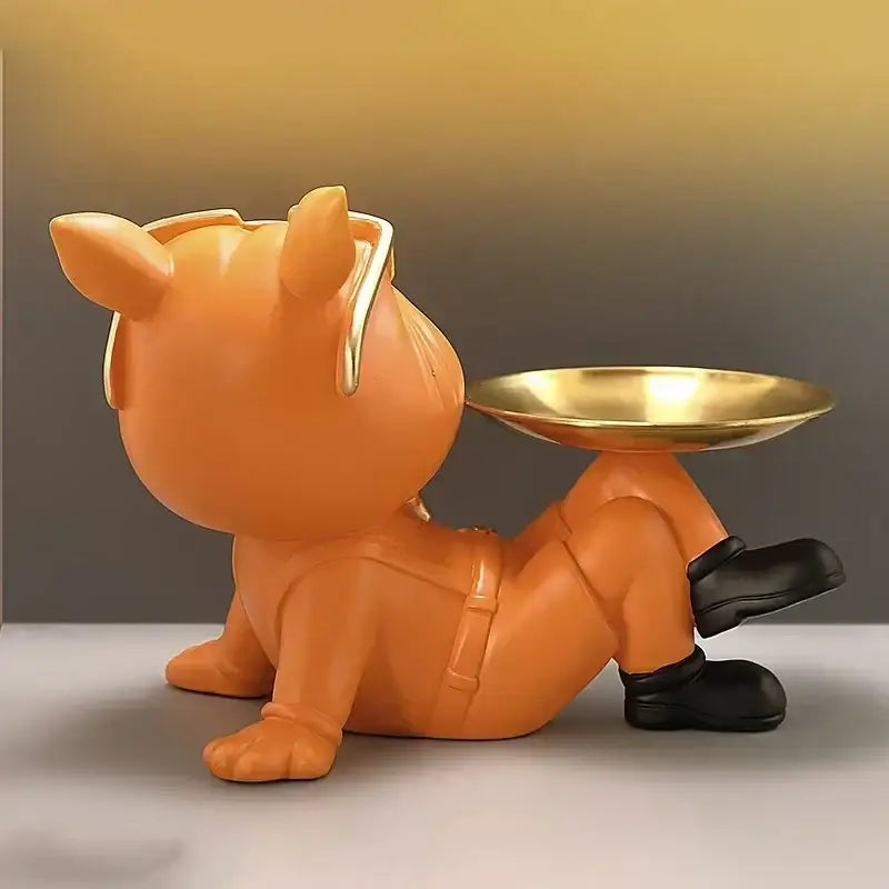 Orange resin cartoon-style cat figurine with black boots holding gold bowl on back in beige french bulldog resin statue decorbites french bulldog
