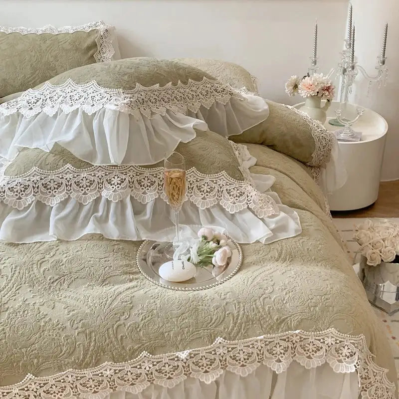 Elegant sage green quilted bedding set with decorbites French lace ruffles and intricate floral embroidery for bedroom decor