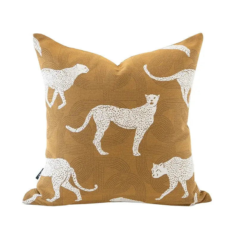 Square mustard-yellow cushion cover with white embroidered cheetah silhouettes decorbites geometric jacquard cushion