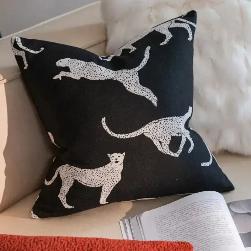 Black throw pillow with white leopard silhouettes featuring dotted patterns for decorbites geometric jacquard cushion cover