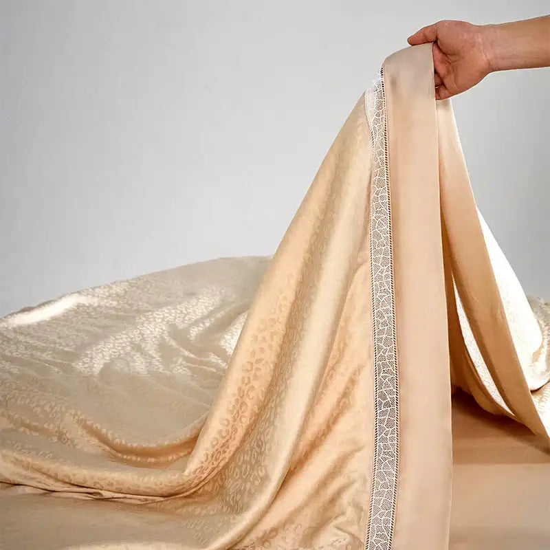 Beige and gold decorbites leopard jacquard summer bedding set with satin floral embroidery and white lace trim detail