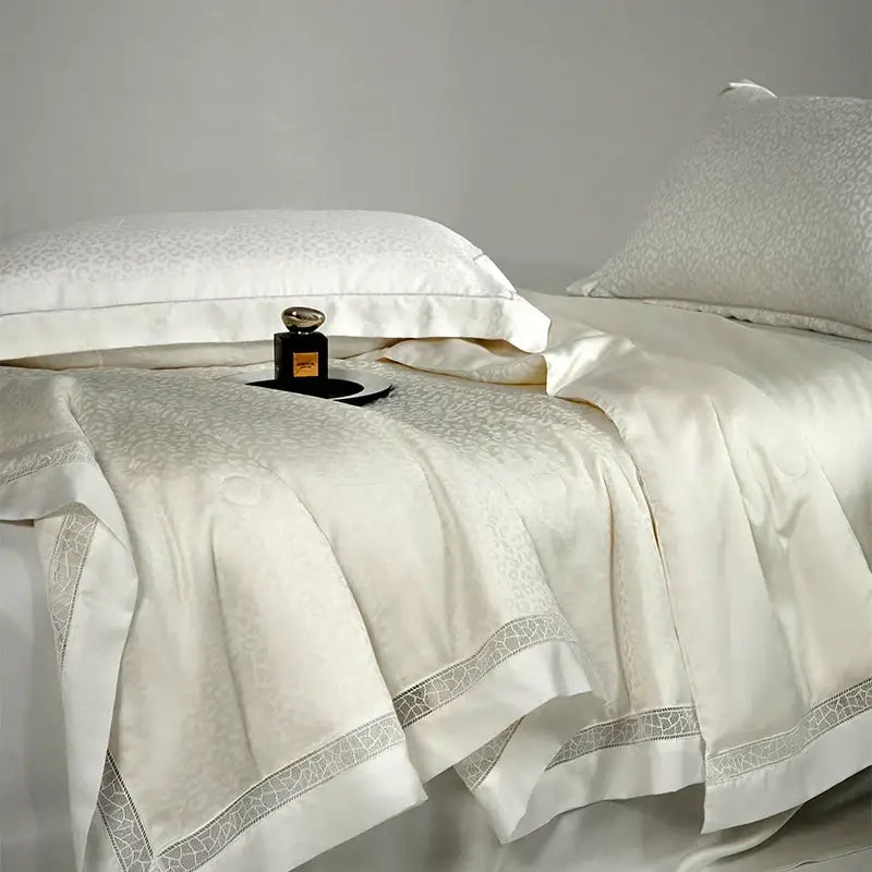 Beige and gold decorbites leopard jacquard summer bedding set with cream satin and silver lace trim features elegant textured pattern