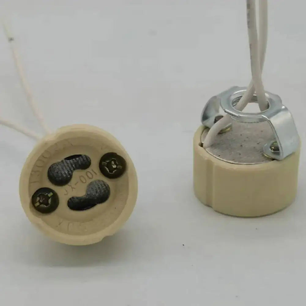 Beige gu10 ceramic socket holder with metal bracket showing ceramic lamp socket with wire terminals and metallic contacts