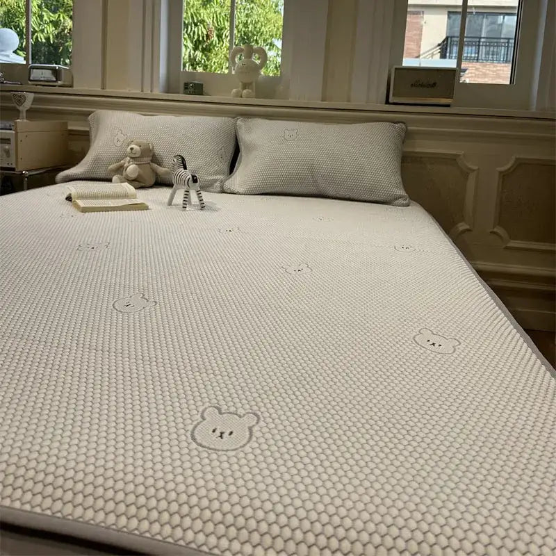 Beige honeycomb cooling mattress pad with embroidered bear faces part of decorbites cooling ice bean sheet set