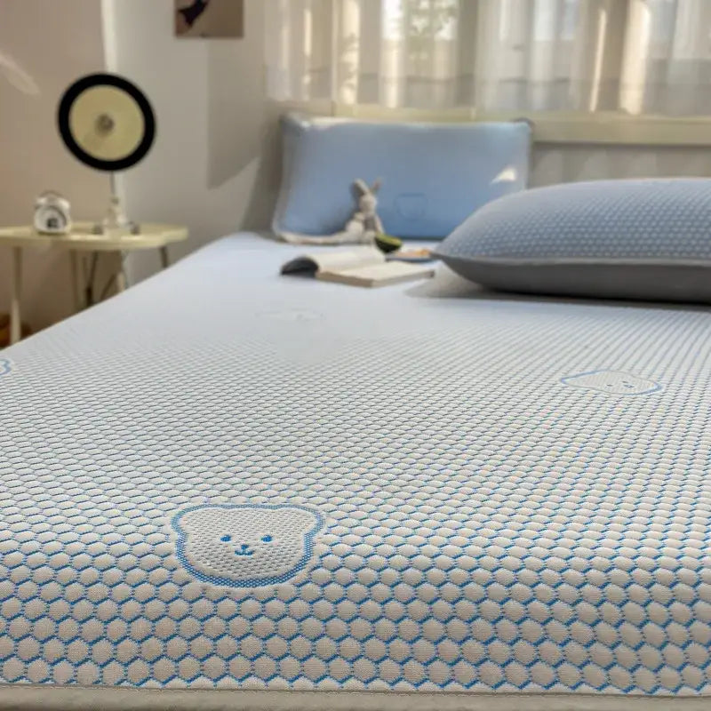 Light blue mesh cooling mattress pad with embroidered bear face design in beige honeycomb bear decorbites cooling ice sheet set