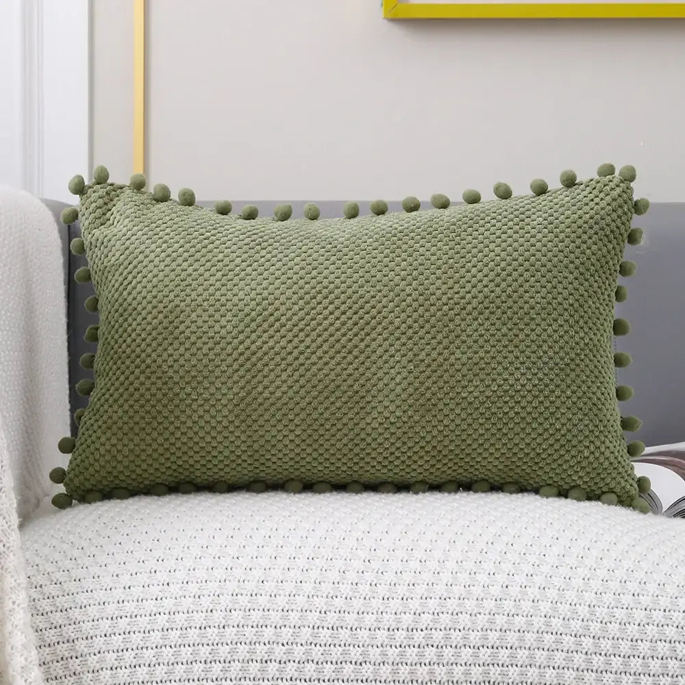 Olive green knitted decorative pillow cover with pom-pom trim for living room decor and accent pillow use