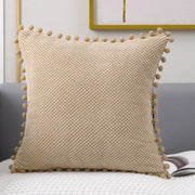 Beige knitted decorative pillow cover with pom-pom trim for living room decor and stylish pillow cover use