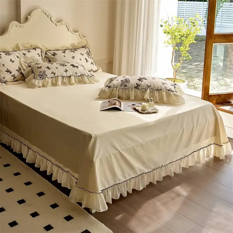 Cream-colored bedding set with beige lace ruffles and black butterfly embroidery for elegant decorbites beige lace decor