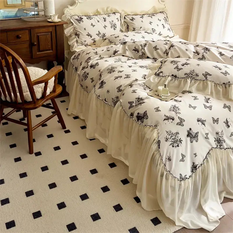 Cream-colored bedding set with beige lace ruffles and black butterfly floral patterns for decorbites beige lace decor