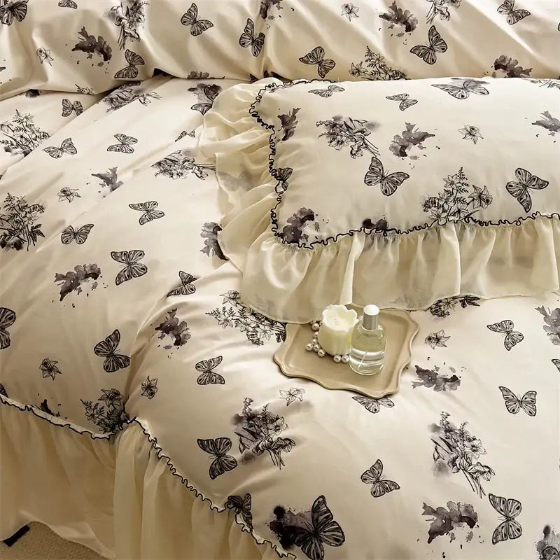 Cream-colored satin bedding set with beige lace ruffles and black butterfly floral prints for decorbites beige lace decor