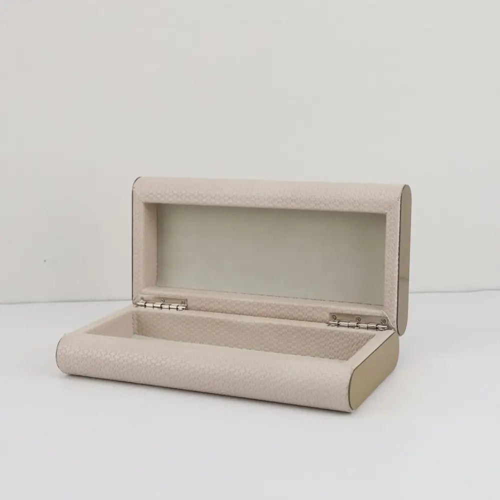Beige textured leather jewelry box with silver-toned hinges by decorbites beige leather for elegant storage container use