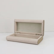 Beige textured leather jewelry box with silver-toned hinges by decorbites beige leather for elegant storage container use