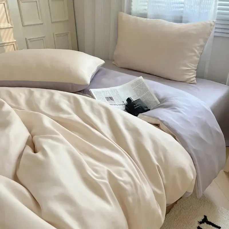 Cream-colored satin duvet cover and pillowcases set from decorbites ice silky solid bedding set in beige and light blue