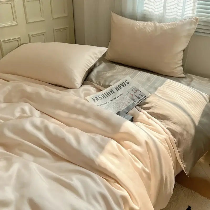 Cream-colored satin duvet cover and pillowcases with a soft glossy finish in decorbites ice silky solid bedding set