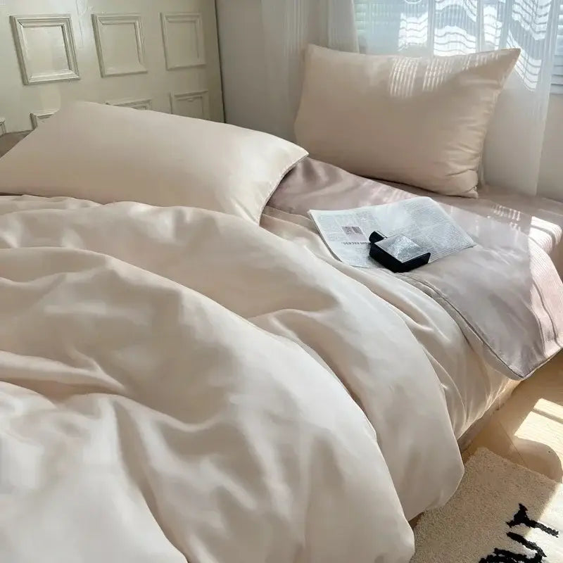 Cream-colored satin duvet cover bedding set with matching pillowcases featuring decorbites ice silky solid finish
