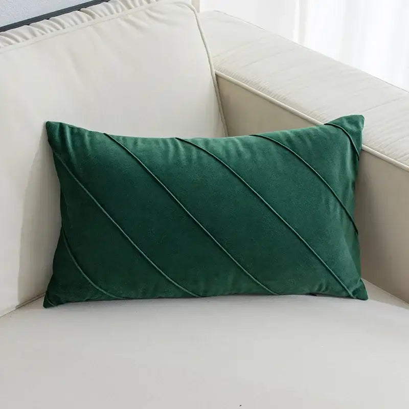 Deep emerald green velvet rectangular pillow with diagonal stitched pleats in hand pleat embroidered cushions style