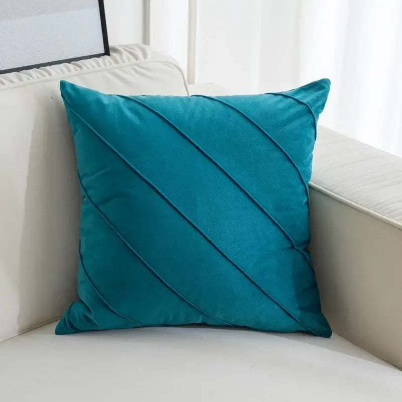 Teal velvet throw pillow with diagonal pleats featuring hand pleat embroidered design for living room decor