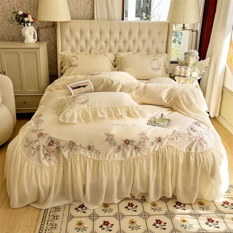 Cream-colored floral embroidered bedding set with ruffled edges and tufted headboard from decorbites beige pink lace collection