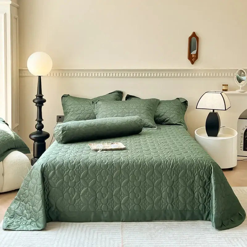Emerald green quilted eucalyptus fiber bedspread with subtle floral pattern and matching pillows from decorbites eucalyptus fiber collection