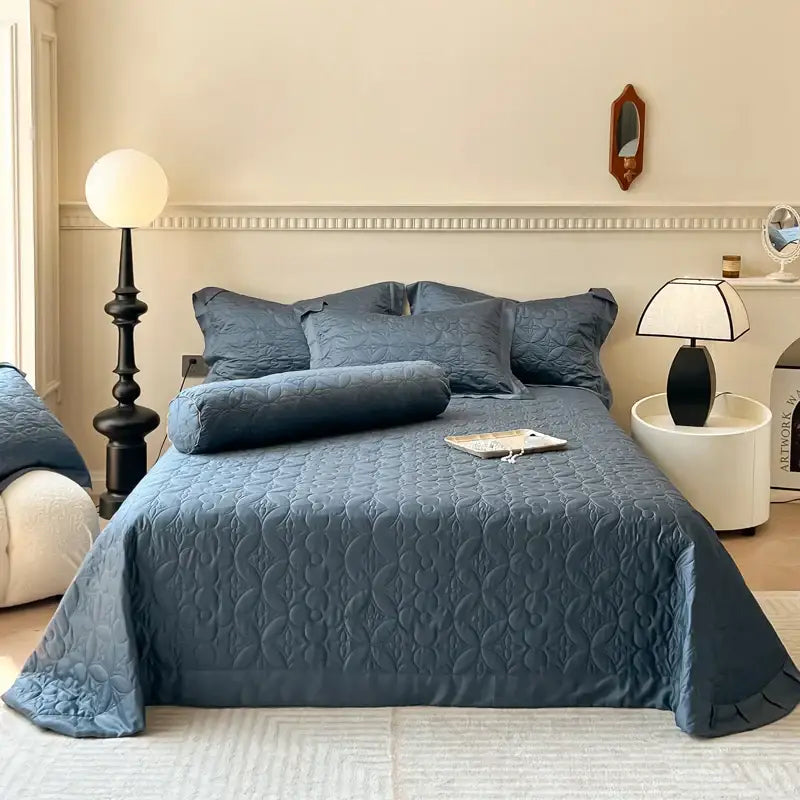 Navy blue quilted eucalyptus fiber bedspread with subtle wave pattern and ruffled edges for decorbites eucalyptus fiber decor