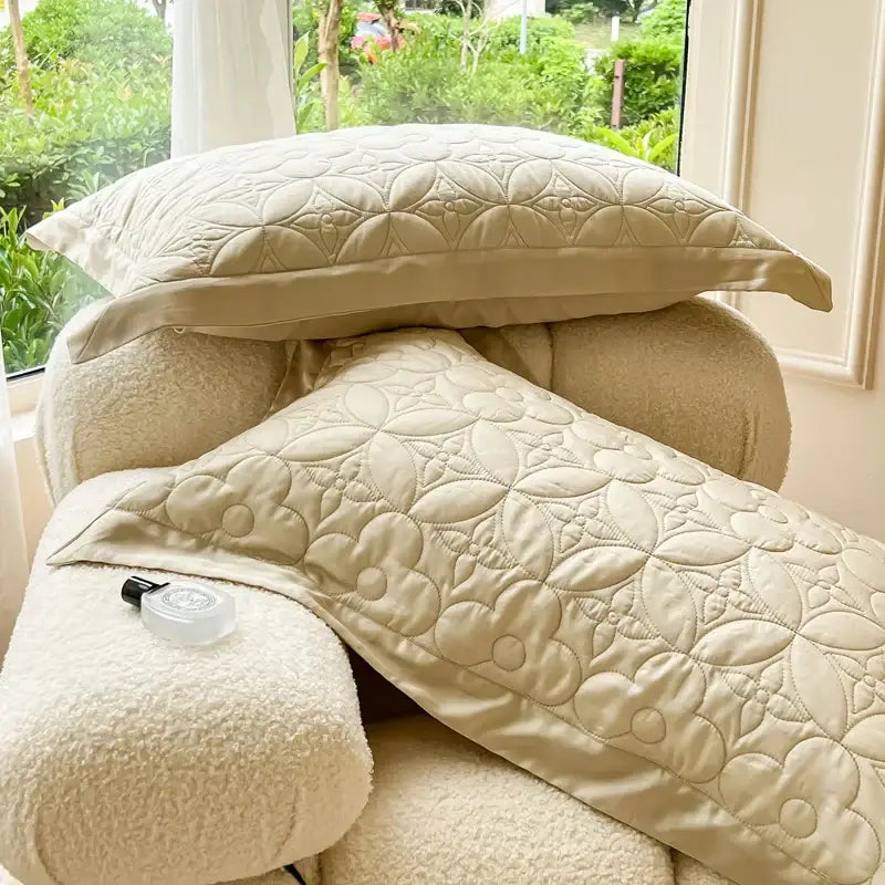 Cream-colored quilted pillow sham with floral pattern and plush texture in beige eucalyptus fiber bedspread decorbites set